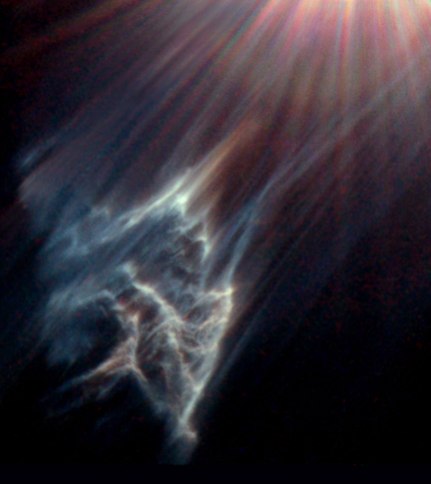 This image shows a dark interstellar cloud ravaged by the passage of Merope, one of the brightest stars in the Pleiades star cluster. Just as a torch beam bounces off the wall of a cave, the star is reflecting light from the surface of pitch-black clouds o